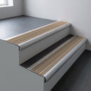 Mill aluminium bullnose stair nosing 66.5x30mm with Fawn Castellated insert fitted on an office stair
