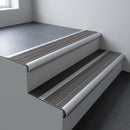 Aluminium bullnose stair nosing 66.5x30mm with Flint Castellated insert fitted on an office stair