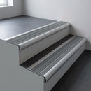 Mill aluminium bullnose stair nosing 66.5x30mm with Flint Castellated insert fitted on an office stair