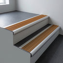 Aluminium bullnose stair nosing 66.5x30mm with Gold Castellated insert fitted on an office stair