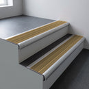 Mill aluminium bullnose stair nosing 66.5x30mm with Gold Castellated insert fitted on an office stair