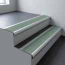 Aluminium bullnose stair nosing 66.5x30mm with Jade Castellated insert fitted on an office stair