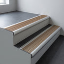 Aluminium bullnose stair nosing 66.5x30mm with Light Bronze Aluminium insert fitted on an office stair