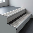 Aluminium bullnose stair nosing 66.5x30mm with Light Grey Castellated insert fitted on an office stair
