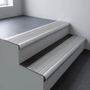 Aluminium bullnose stair nosing 66.5x30mm with Mill Aluminium insert fitted on an office stair
