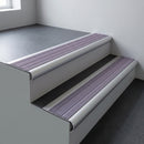 Aluminium bullnose stair nosing 66.5x30mm with Nimbus Castellated insert fitted on an office stair