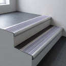 Mill aluminium bullnose stair nosing 66.5x30mm with Nimbus Castellated insert fitted on an office stair