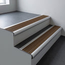 Aluminium bullnose stair nosing 66.5x30mm with Olive Castellated insert fitted on an office stair