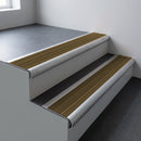 Mill aluminium bullnose stair nosing 66.5x30mm with Olive Castellated insert fitted on an office stair