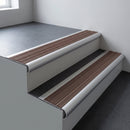 Aluminium bullnose stair nosing 66.5x30mm with Peat Castellated insert fitted on an office stair