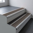 Mill aluminium bullnose stair nosing 66.5x30mm with Peat Castellated insert fitted on an office stair