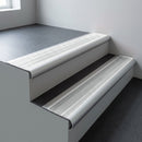 Aluminium bullnose stair nosing 66.5x30mm with Polar Grey Smooth Textured insert fitted on an office stair