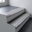 Polished aluminium bullnose stair nosing 66.5x30mm with Polished Aluminium insert fitted on an office stair