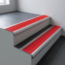 Mill aluminium bullnose stair nosing 66.5x30mm with Poppy castellated insert fitted on an office stair