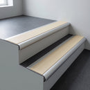 Aluminium bullnose stair nosing 66.5x30mm with Porth Stone Smooth Textured insert fitted on an office stair