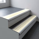 Mill aluminium bullnose stair nosing 66.5x30mm with Porth Stone Smooth Textured insert fitted on an office stair