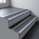Aluminium bullnose stair nosing 66.5x30mm with Regency Castellated insert fitted on an office stair