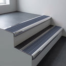 Polished aluminium bullnose stair nosing 66.5x30mm with Regency Castellated insert fitted on an office stair