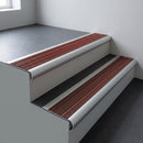 Aluminium bullnose stair nosing 66.5x30mm with Rustic Castellated insert fitted on an office stair