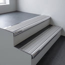 Polished aluminium bullnose stair nosing 66.5x30mm with Satin Aluminium insert fitted on an office stair