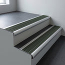 Aluminium bullnose stair nosing 66.5x30mm with Spruce Castellated insert fitted on an office stair