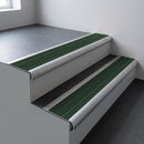 Mill aluminium bullnose stair nosing 66.5x30mm with Spruce Castellated insert fitted on an office stair