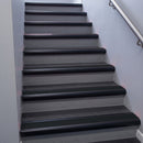 Black Anodised bullnose stair nosing 68x40mm with Black Smooth Textured insert, fitted to an interior stairwell