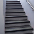 Black Anodised bullnose stair nosing 68x40mm with Flint Castellated insert, fitted to an interior stairwell