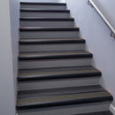 Black Anodised bullnose stair nosing 68x40mm with Granite Castellated insert, fitted to an interior stairwell