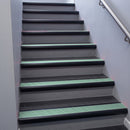 Black Anodised bullnose stair nosing 68x40mm with Jade Castellated insert, fitted to an interior stairwell