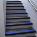 Black Anodised bullnose stair nosing 68x40mm with Mid Blue Castellated insert, fitted to an interior stairwell