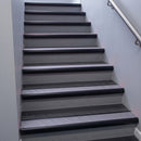 Black Anodised bullnose stair nosing 68x40mm with Nimbus Castellated insert, fitted to an interior stairwell