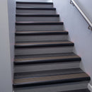 Black Anodised bullnose stair nosing 68x40mm with Peat Castellated insert, fitted to an interior stairwell