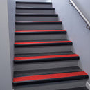 Black Anodised bullnose stair nosing 68x40mm with Poppy Castellated insert, fitted to an interior stairwell