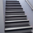Black Anodised bullnose stair nosing 68x40mm with Satin Aluminium insert, fitted to an interior stairwell