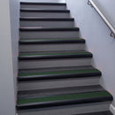 Black Anodised bullnose stair nosing 68x40mm with Spruce Castellated insert, fitted to an interior stairwell