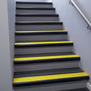 Black Anodised bullnose stair nosing 68x40mm with Yellow Castellated insert, fitted to an interior stairwell