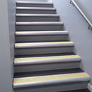 Mill Aluminium bullnose stair nosing 68x40mm with Ivory Castellated insert, fitted to an interior stairwell