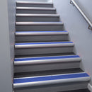 Mill Aluminium bullnose stair nosing 68x40mm with Mid Blue Castellated insert, fitted to an interior stairwell