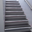 Polished Aluminium bullnose stair nosing 68x40mm with Black Castellated insert, fitted to an interior stairwell