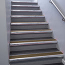 Polished Aluminium bullnose stair nosing 68x40mm with Bronze Aluminium insert, fitted to an interior stairwell