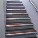 Polished Aluminium bullnose stair nosing 68x40mm with Claret Castellated insert, fitted to an interior stairwell