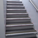 Polished Aluminium bullnose stair nosing 68x40mm with Granite Castellated insert, fitted to an interior stairwell