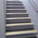 Polished Aluminium bullnose stair nosing 68x40mm with Ivory Castellated insert, fitted to an interior stairwell