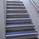 Polished Aluminium bullnose stair nosing 68x40mm with Mid Blue Castellated insert, fitted to an interior stairwell