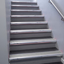 Polished Aluminium bullnose stair nosing 68x40mm with Mill Aluminium insert, fitted to an interior stairwell