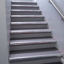 Polished Aluminium bullnose stair nosing 68x40mm with Nimbus Castellated insert, fitted to an interior stairwell