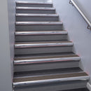 Polished Aluminium bullnose stair nosing 68x40mm with Peat Castellated insert, fitted to an interior stairwell