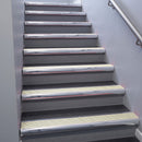 Polished Aluminium bullnose stair nosing 68x40mm with Porth Stone Castellated insert, fitted to an interior stairwell