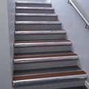 Polished Aluminium bullnose stair nosing 68x40mm with Rustic Castellated insert, fitted to an interior stairwell